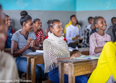 Students sitting and laughing in a classroom at Yirba Yanase Primary and Secondary School in Hawassa, Ethiopia.