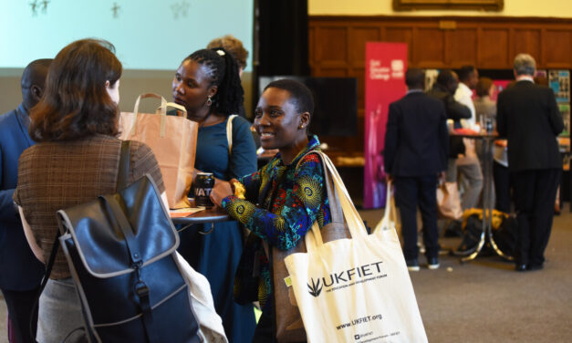 A group of people chatting at an event