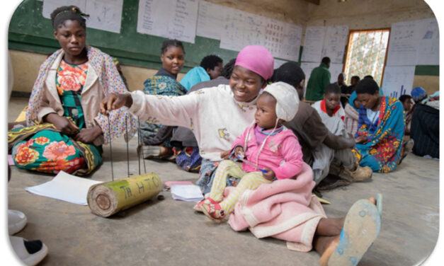 Learner with baby in a community-based accelerated learning centre, Malawi.