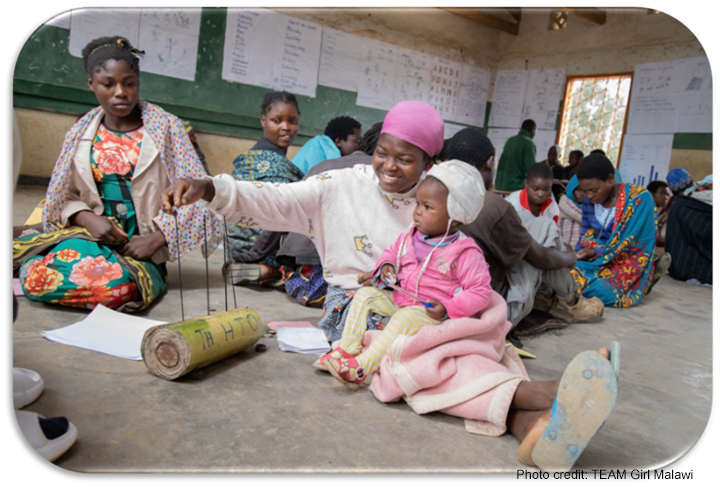 Learner with baby in a community-based accelerated learning centre, Malawi.