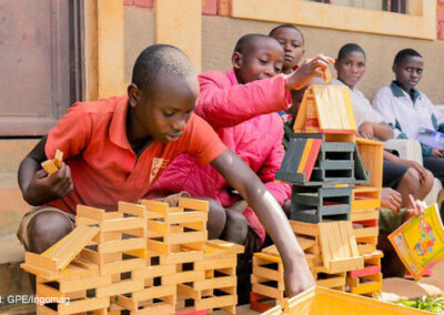 Students build during an educational activity at Isare Youth Center, Burundi.