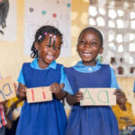 Pre-school children in Malawi learn the alphabet.