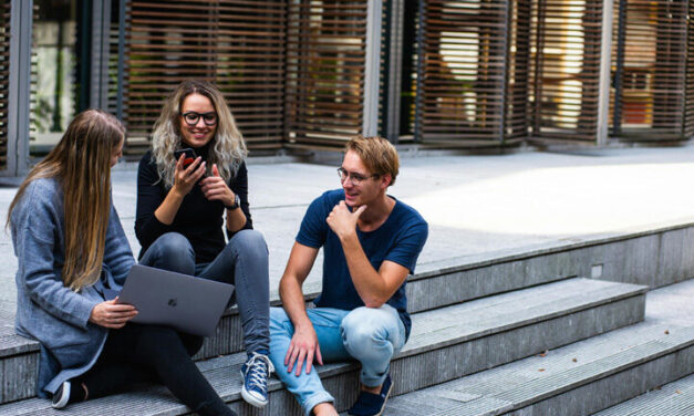 Young people sitting chatting on steps