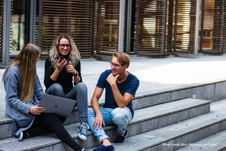 Young people sitting chatting on steps