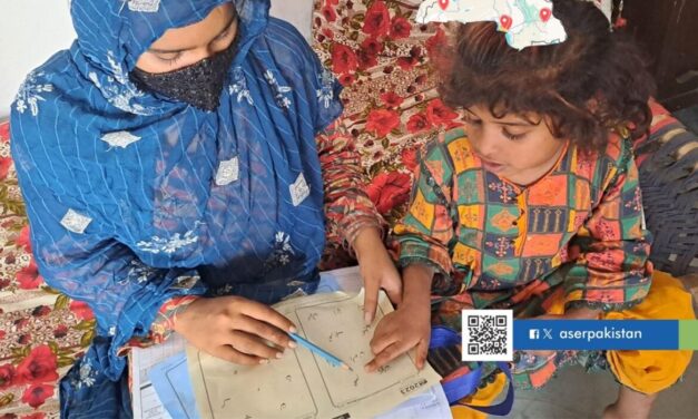 A female teacher sits on the floor with a girl student, Pakistan. QR Code for Facebook and X ACER Pakistan