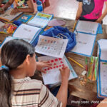 A student going through her workbook in class, Chile.