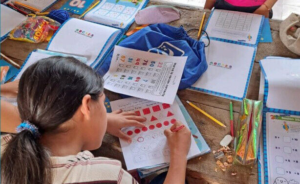 A student going through her workbook in class, Chile.