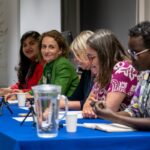 Photo of a panel of women speakers