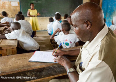 A teacher and students in class at the Nyamachaki Primary School, Nyeri County, Kenya.