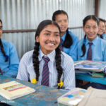 Girls in Class 10 sit at their desks in Sindhupalchowk District, Nepal.