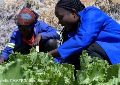 Esther (left) and Naomi (right), CAMFED Association members and Agriculture Guides, at a climate-smart teaching farm in Chinsali, Zambia.