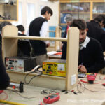 Students in electronic lab activity, Peshawar, Pakistan.