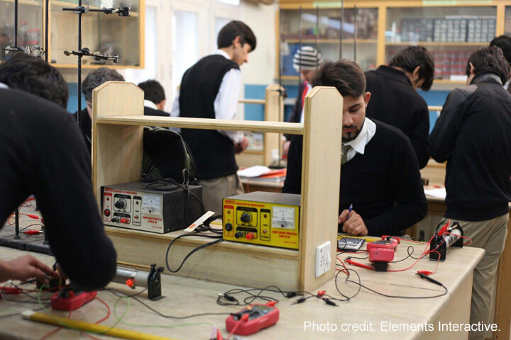 Students in electronic lab activity, Peshawar, Pakistan.