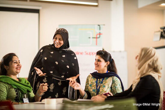 Group of female teachers at a training session, India.