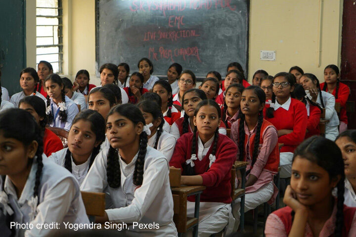 Ruptures and reclamations Girls sit in a packed classroom, India.