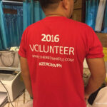 Person wearing a red TShirt with 2016 Volunteer on the back