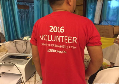 Person wearing a red TShirt with 2016 Volunteer on the back