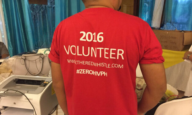 Person wearing a red TShirt with 2016 Volunteer on the back