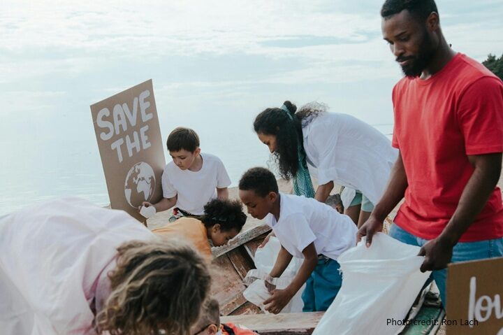 A team collect rubbish on a beach clean