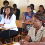 Teachers sit in a classroom for training, DRC.