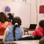 The back of children’s heads in a classroom, Lebanon.