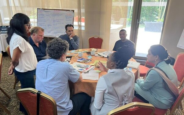 Group of people around a workshop table