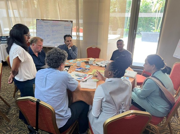Group of people around a workshop table