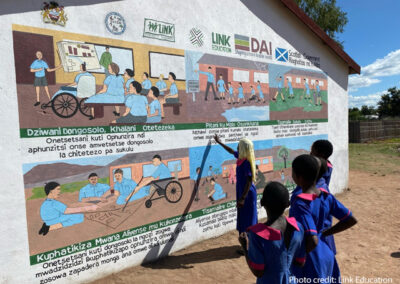 Children look at a school mural, Malawi