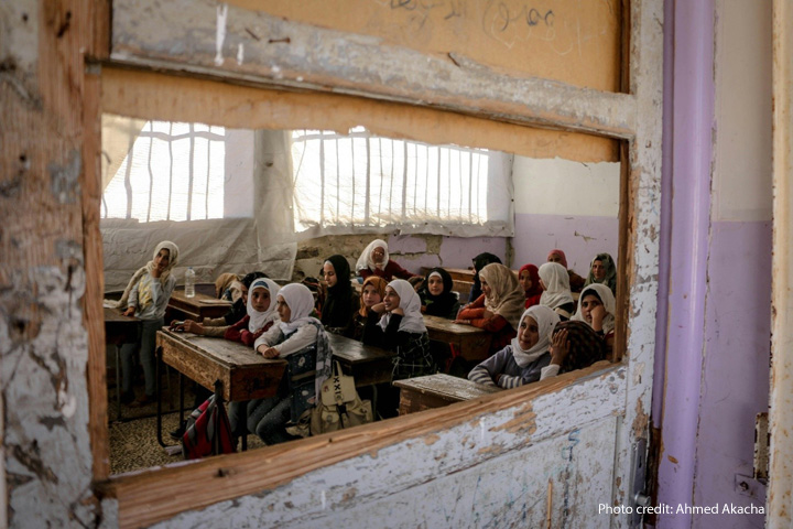 What happened to girls education Children sit in a destroyed classroom, Syria. Viewed through an broken window
