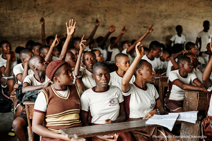 Children sit in crowded classroom, Rivers State, Nigeria.